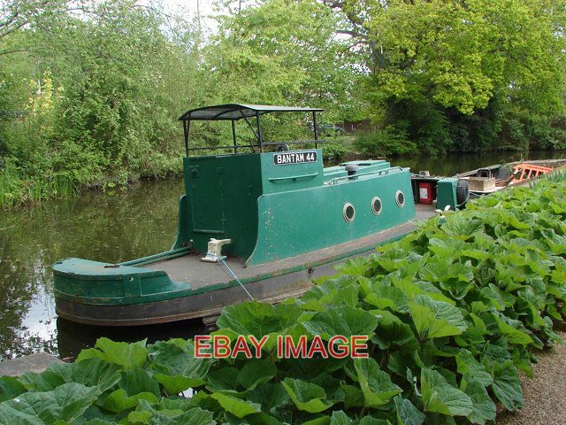 PHOTO  BASINGSTOKE CANAL A TUG BOAT MOORED ON THE CANAL. 2010 - Picture 1 of 1